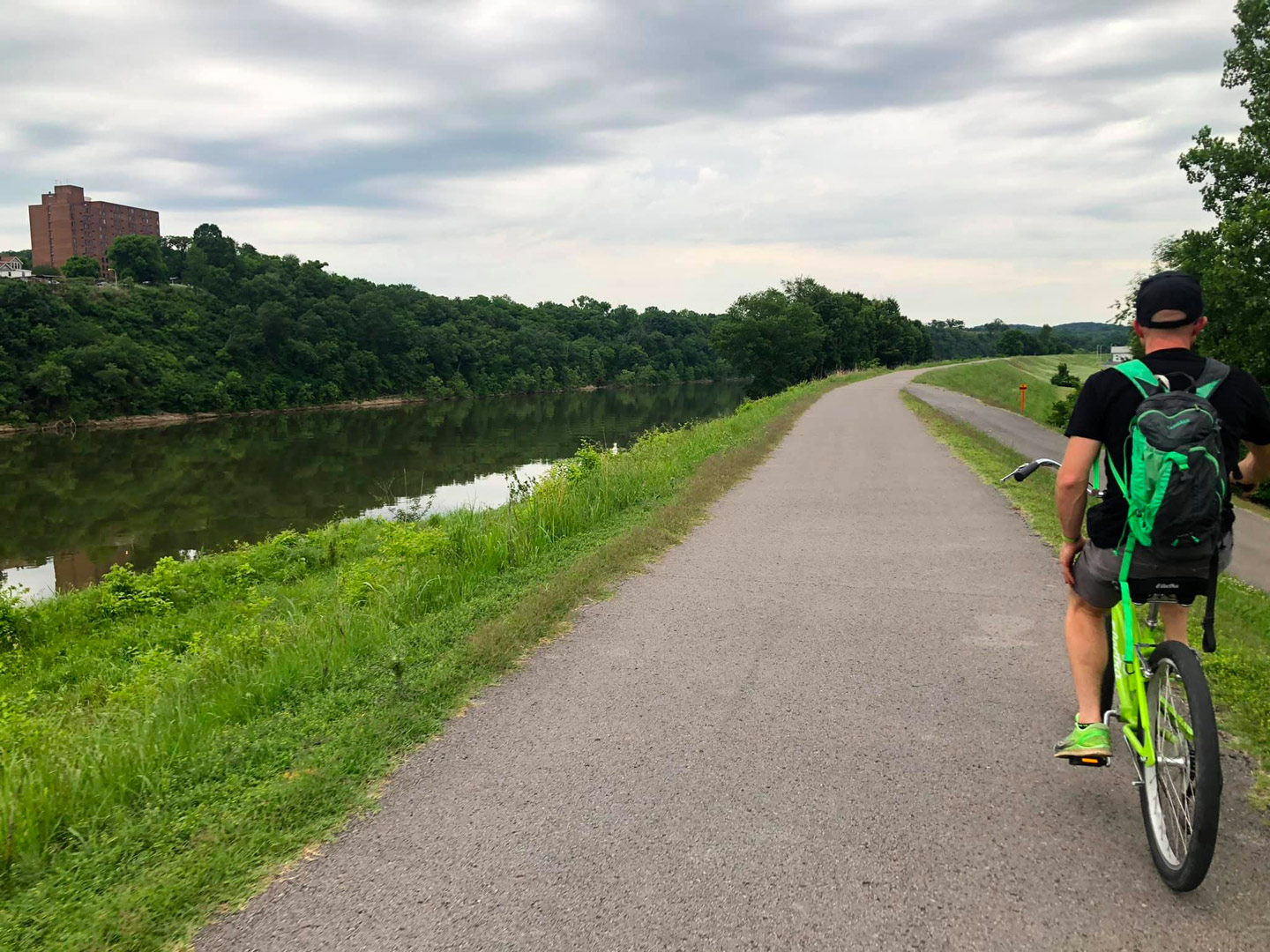 Man riding bike on greenway