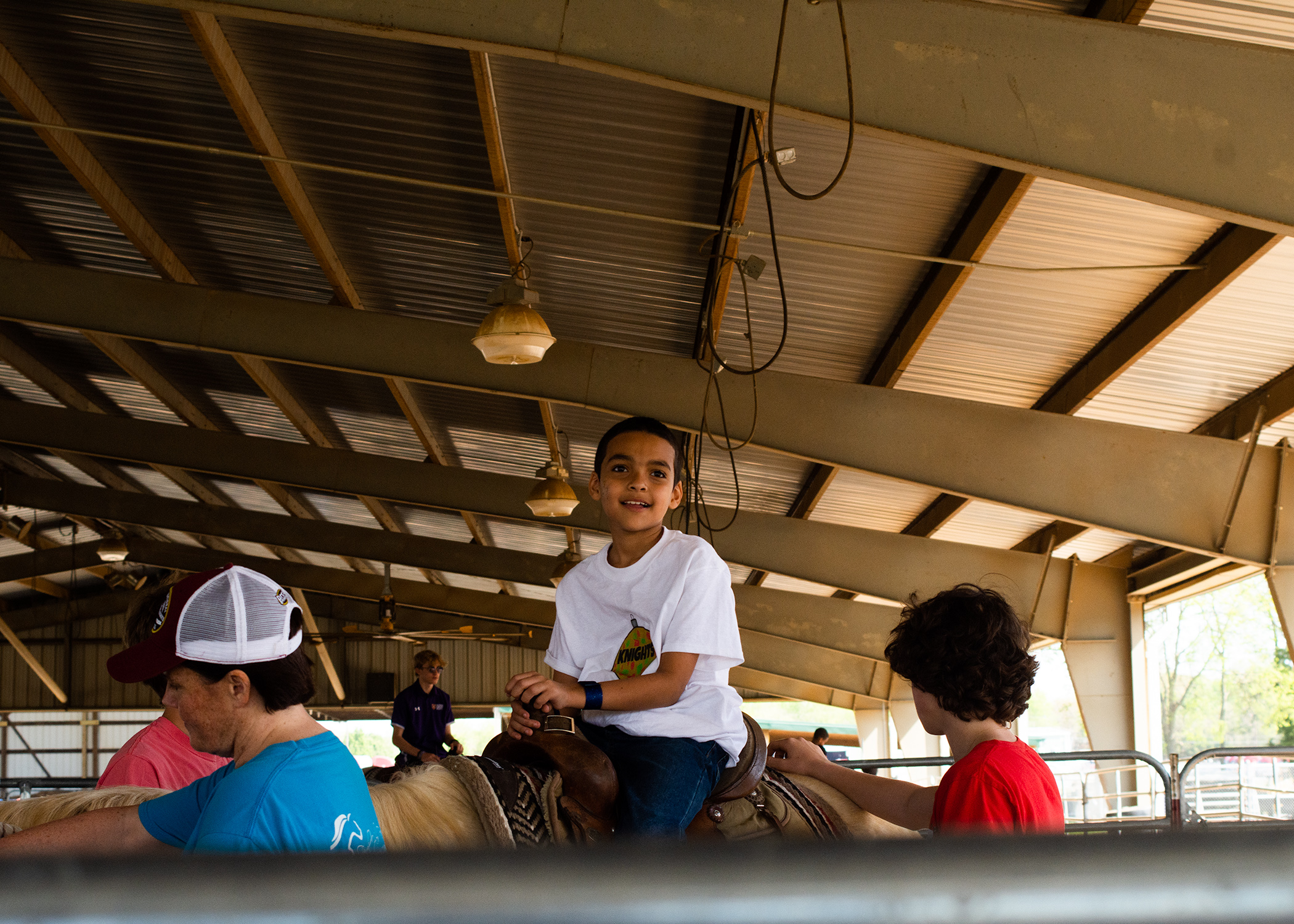 Child rides horse at Whip Crackin' Rodeo, Wilson County