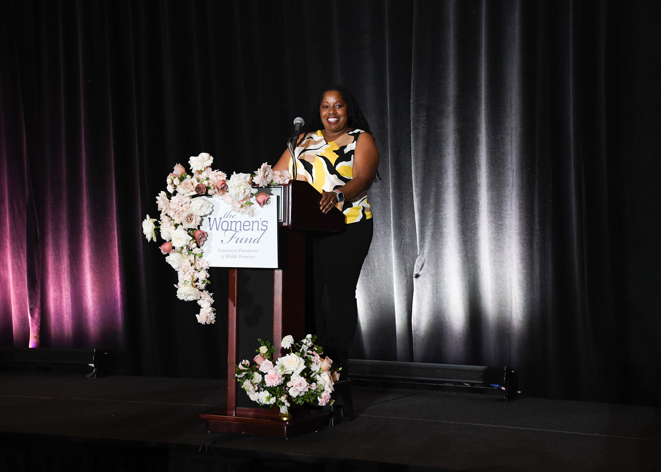 Fisk Gymnastics Head Coach Corrinne Tarver 2024 the Power of the Purse Keynote Speaker talks to the gathering