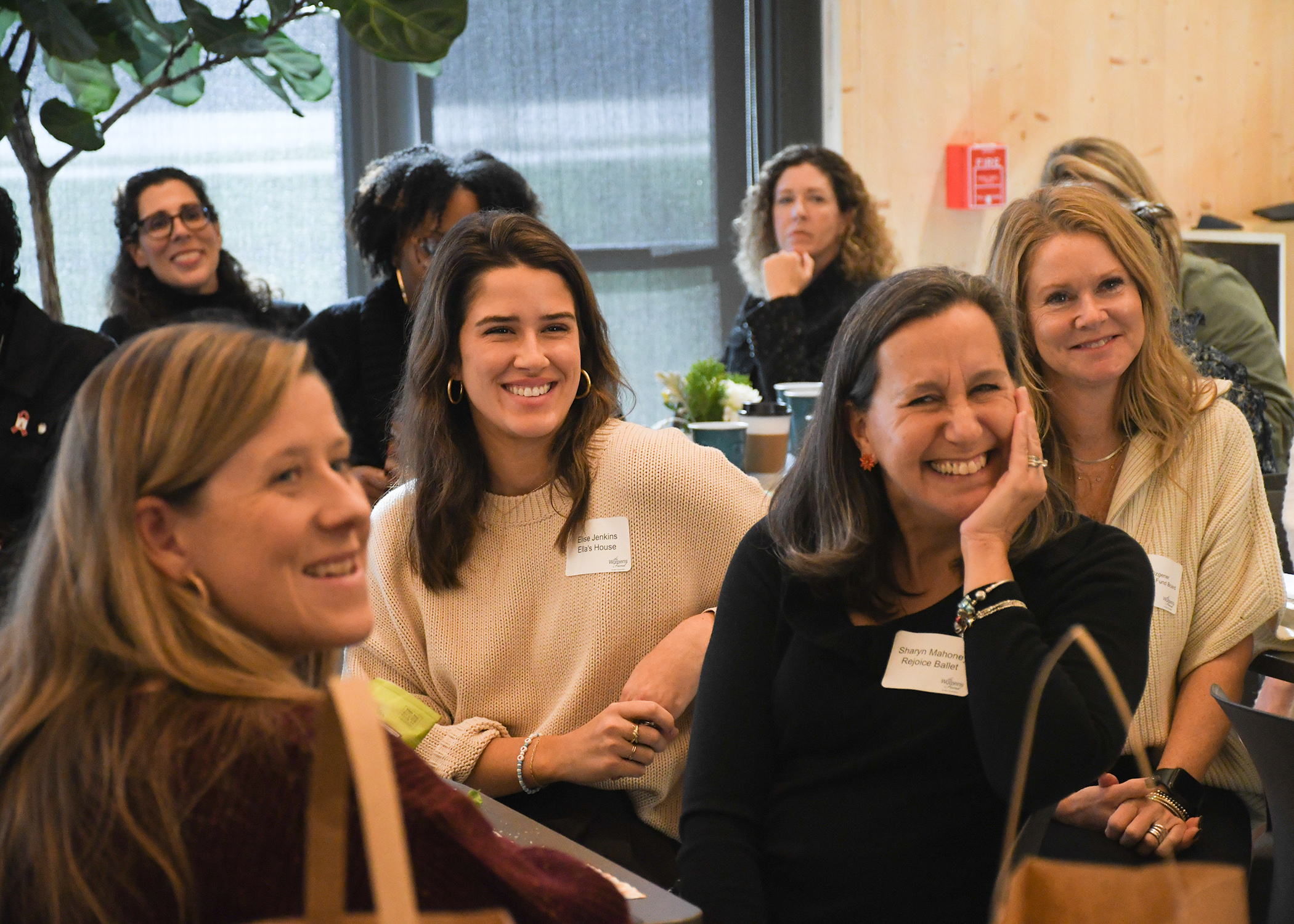 Women smile at the Women's Fund grantmaking event 2024